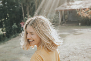 woman laughing in sunshine