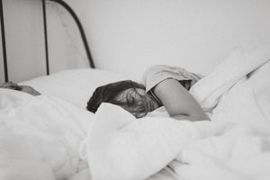 woman under comforter