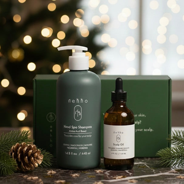 Two haircare products, a shampoo bottle and a oil dropper, with a green box in the background.